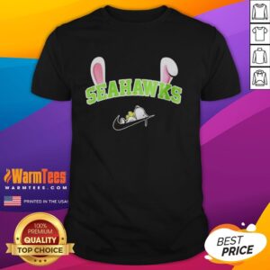 Official Seattle Seahawks X Snoopy Happy Easter T-Shirt featuring Snoopy and Seahawks logo, perfect for Easter celebrations.