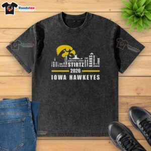 Alt Text: 2026 Iowa Hawkeyes washed t-shirt featuring all names and the city skyline design.