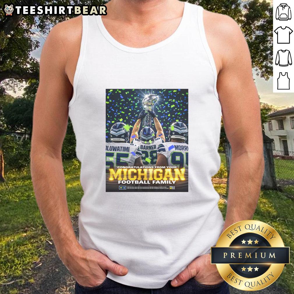 awesome-oluwatimi-barner-morr-seattle-seahawks-holding-trophy-congratulations-from-your-michigan-tank-top Alt Text: Awesome Oluwatimi Barner Morr celebrates with trophy in Seattle Seahawks gear and Michigan tank top. Congrats!