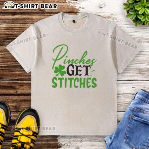 Official Pinches Get Stitches Irish washed t-shirt featuring a classic design for St. Patrick's Day celebrations.