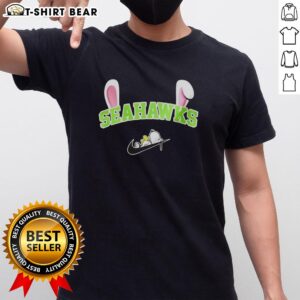 Pretty Seattle Seahawks X Snoopy Happy Easter T-Shirt featuring festive graphics for fans celebrating Easter.