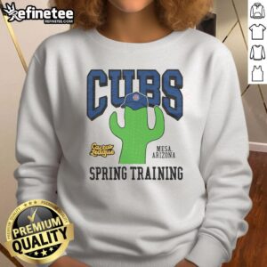 Alt Text: Cozy Chicago Cubs Cactus League sweatshirt in vibrant blue, perfect for fans supporting their team during spring training.