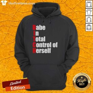Stylish woman wearing a Premium Babe In Total Control Of Herself Hoodie, showcasing confidence and fashion-forward design.