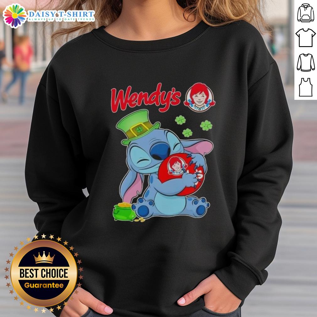 Cute Stitch With St Patricks Hug Wendy'S Logo Sweatshirt Cute Stitch hugging a St. Patrick's Day logo on a Wendy's sweatshirt, perfect festive wear for the holiday.