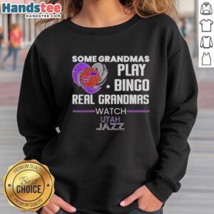 Premium sweatshirt featuring grandmas playing bingo while watching Utah Jazz, perfect for dedicated fans and cozy wear.