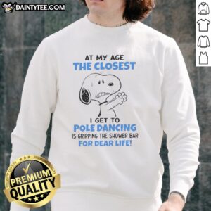 Alt Text: Funny Peanuts Snoopy sweatshirt with the quote about aging and shower bar gripping, perfect for humor lovers.