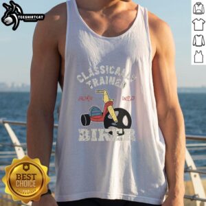 Classically trained biker wearing a 'Born Wild' tank top, showcasing a stylish blend of fashion and freedom on the road.