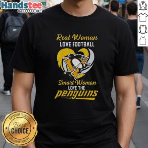 Pretty real woman wearing a Pittsburgh Penguins heart t-shirt, showing love for football and hockey in a stylish outfit.