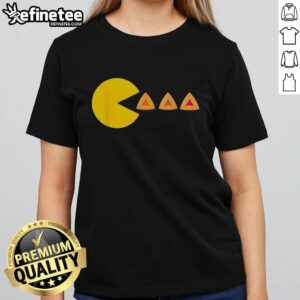 Jewish lady in a Pacman costume eating hamantashen for Purim celebration, showcasing a fun and festive attire.