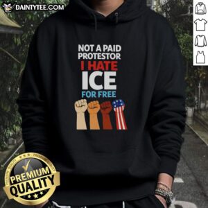 Person wearing 'Hot Not A Paid Protestor I Hate Ice For Free' hoodie, showcasing bold statement on social issues.