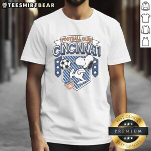 Official Peanuts Snoopy X FC Cincinnati T-Shirt featuring Snoopy in team colors, perfect for fans and collectors.