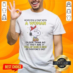 Alt Text: Nice Peanuts Snoopy t-shirt design: 'Never Pick A Fight With A Woman Older Than 60' with cartoon graphics.