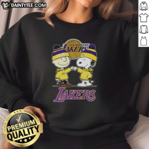 Alt Text: Good Charlie Brown Touch Hand Snoopy X Los Angeles Lakers logo sweatshirt featuring iconic cartoon designs.