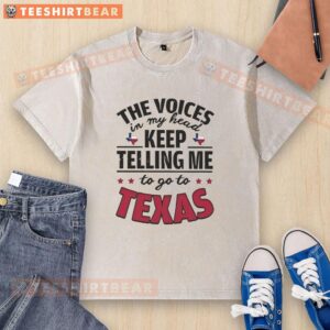Alt Text: Funny The Voices In My Head Keep Telling Me To Go To Texas washed t-shirt featuring a humorous graphic design.