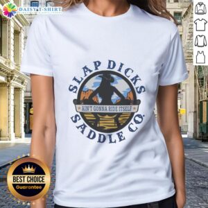 Alt Text: Premium Ain't Gonna Ride Itself Slap Dicks Saddle Co logo on a stylish ladies tee, perfect for equestrian enthusiasts.