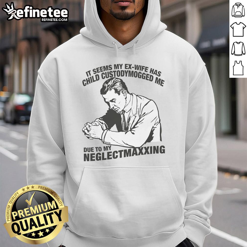 funny-it-seems-my-ex-wife-has-child-custodymogged-me-due-to-my-neglectmaxxing-hoodie Man wearing 'Funny It Seems My Ex-Wife Has Child Custody Mogged Me Due to My Neglect' hoodie, showcasing humor in parenting.