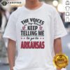 Funny 'The Voices In My Head Keep Telling Me To Go To Arkansas' T-Shirt design featuring playful graphics and bold text.