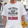 Funny t-shirt featuring 'The Voices In My Head Keep Telling Me To Go To Delaware' slogan, perfect for humor lovers.