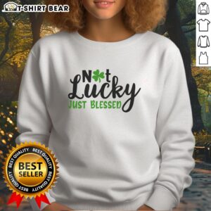 Official Not Lucky Just Blessed Irish Sweatshirt in green with graphic text, perfect for St. Patrick's Day celebrations.
