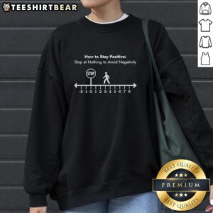 Alt Text: Cozy sweatshirt featuring the phrase 'Stop At Nothing To Avoid Negativity' for a positive mindset.