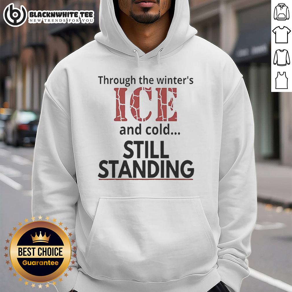 Hot Streets Of Minneapolis Through The Winter's ICE And Cold Still Standing Hoodie Stylish hoodie on display against the icy streets of Minneapolis, showcasing warmth in winter's cold embrace.