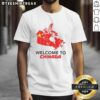 Alt Text: Hot Welcome to Chinada Canada Map Caricature T-Shirt featuring vibrant graphics and unique design for tourists.