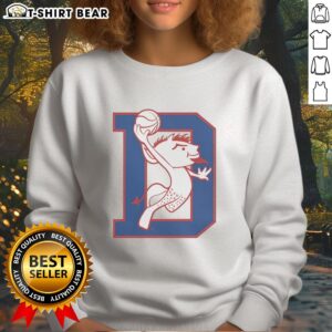 Alt Text: DePaul Blue Demons mascot dunking in a vibrant sweatshirt, showcasing team spirit and basketball enthusiasm.