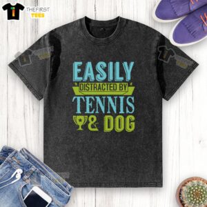 Funny easily distracted dog in a washed t-shirt, playfully focused on tennis ball, capturing a lighthearted moment.