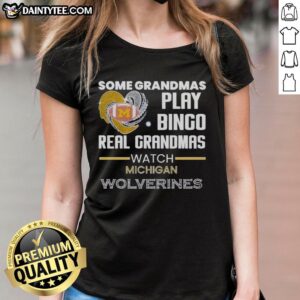 Real grandmas play bingo while wearing Michigan Wolverines ladies tee, showcasing fun and team spirit.