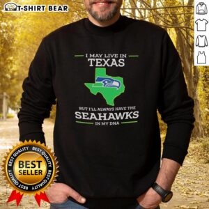 Alt Text: Person wearing a Seattle Seahawks sweatshirt, showcasing pride in team spirit while living in Texas.