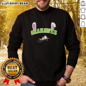 Pretty Seattle Seahawks x Snoopy Happy Easter sweatshirt featuring colorful graphics and festive design for fans.