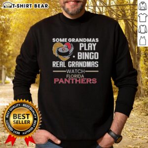 Grandmas play bingo while wearing Florida Panthers sweatshirt, showcasing fun and camaraderie in an awesome gathering.