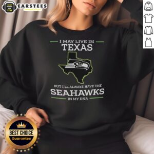 Funny sweatshirt design: 'I may live in Texas, but I'll always have the Seahawks in my DNA' showcasing team spirit.