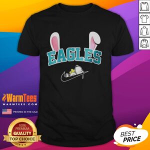 Official Philadelphia Eagles X Snoopy Happy Easter T-Shirt featuring a festive design for fans celebrating Easter.
