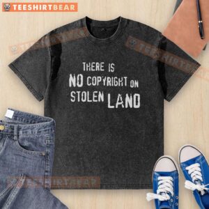 Top 'There Is No Copyright On Stolen Land' washed t-shirt, featuring a bold graphic design for eco-conscious fashion.