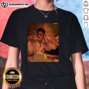 Bruno Mars and a rose enjoying pizza at the 2026 Grammy Awards in a stylish ladies tee, celebrating music and fashion.