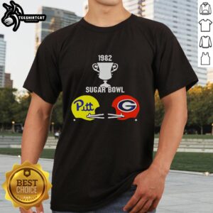Alt Text: Vintage 1982 Sugar Bowl graphic t-shirt featuring Pitt vs Georgia helmets and trophy design, perfect for sports fans.