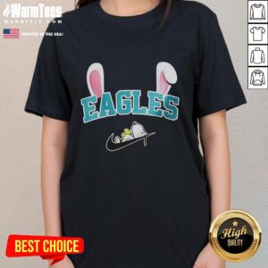 Official Philadelphia Eagles X Snoopy Happy Easter ladies tee featuring vibrant graphics and festive design for fans.