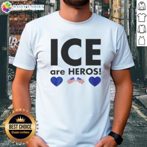 Alt Text: Top Ice Are Heroes Flag T-Shirt featuring a bold graphic design of a flag, perfect for patriotic fans and casual wear.