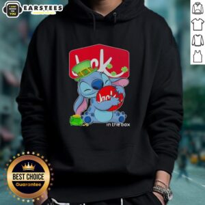 Cute Stitch hugging Jack in the Box logo on a Happy St. Patrick's Day hoodie for festive celebrations.