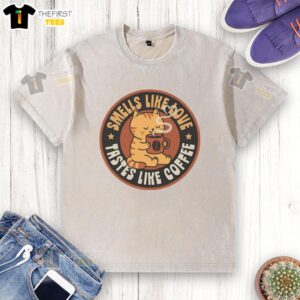 Good Smells Like Love Taste Like Coffee washed t-shirt displayed on a rustic wooden table, perfect for coffee lovers.