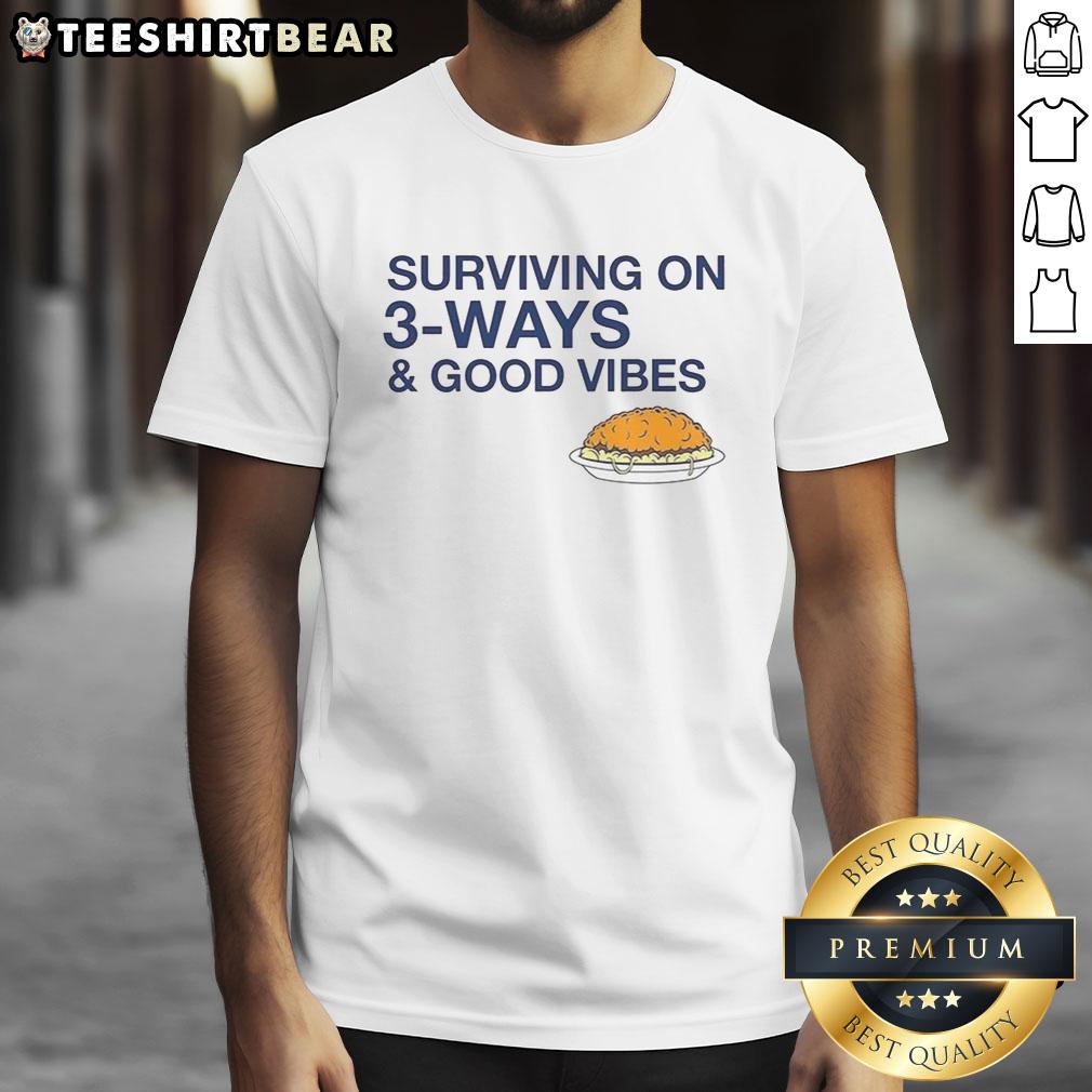 official-cincinnati-chili-surviving-on-3-ways-and-good-vibes-t-shirt-1 Alt Text: Official Cincinnati Chili T-Shirt featuring 'Surviving on 3-Ways and Good Vibes' design in vibrant colors.