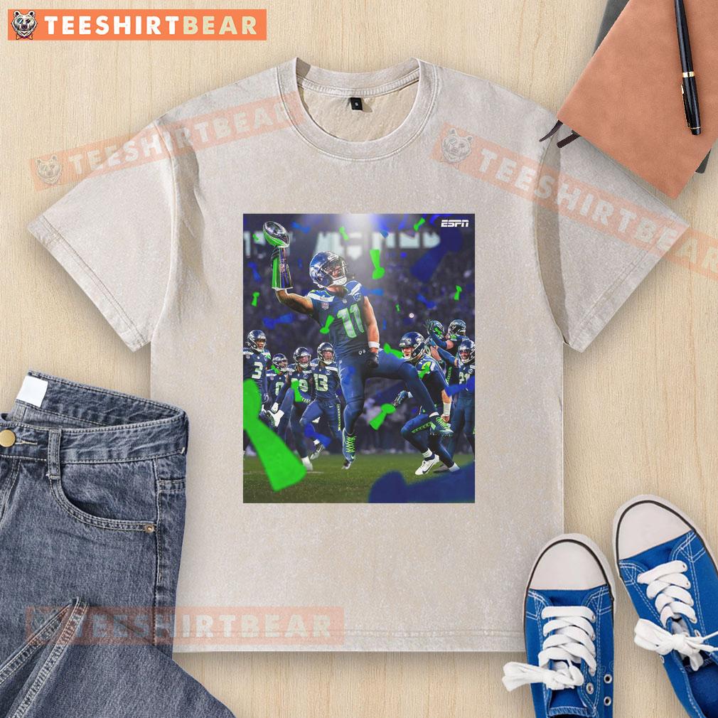 official-jaxon-smith-njigba-seattle-seahawks-super-bowl-lx-champions-2026-celebrate-victory-washed-t-shirt Jaxon Smith-Njigba wearing a Seattle Seahawks Super Bowl LX Champions 2026 t-shirt, celebrating victory in style.