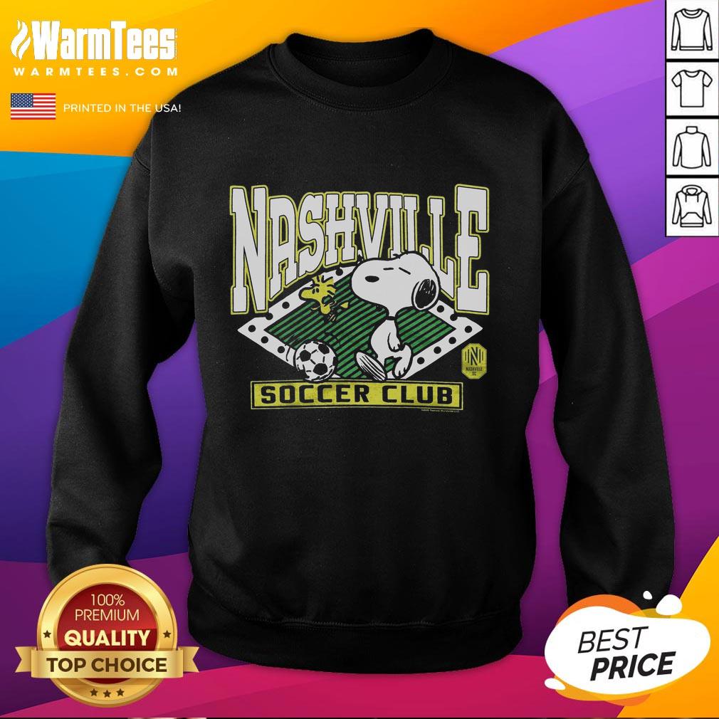 official-peanuts-snoopy-x-nashville-sc-sweatshirt Alt Text: Official Peanuts Snoopy x Nashville SC sweatshirt featuring a vibrant design perfect for fans and casual wear.