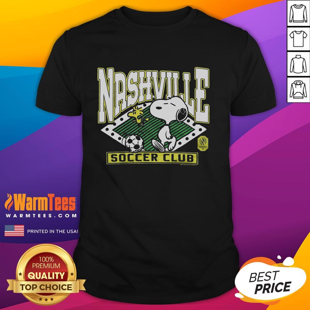 official-peanuts-snoopy-x-nashville-sc-t-shirt-1 Alt Text: Official Peanuts Snoopy X Nashville SC t-shirt featuring Snoopy and soccer graphics in vibrant colors.