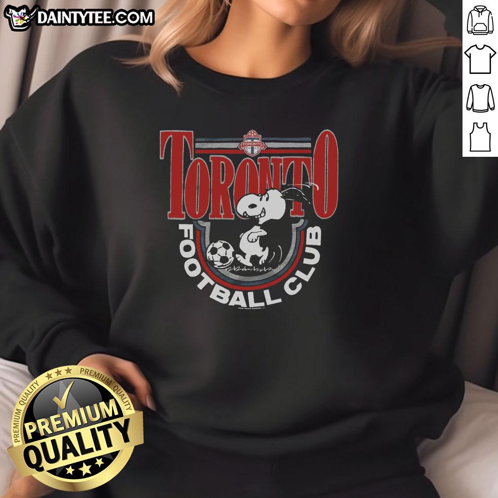 official-peanuts-snoopy-x-toronto-fc-sweatshirt Official Peanuts Snoopy x Toronto FC sweatshirt featuring Snoopy in team colors, perfect for fans and cozy wear.