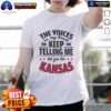 Alt Text: Official The Voices In My Head Keep Telling Me To Go To Kansas T-Shirt featuring bold graphic design and vibrant colors.