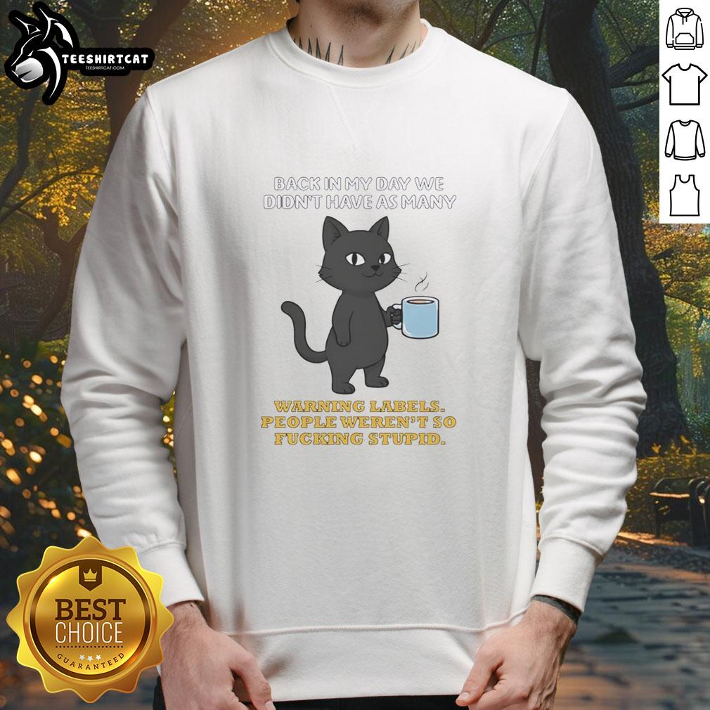 original-cat-back-in-my-day-we-didnt-have-as-many-warnning-labels-people-werent-so-fcking-stupid-sweatshirt Alt Text: Funny sweatshirt featuring a cat graphic with text about warning labels and common sense, perfect for cat lovers.