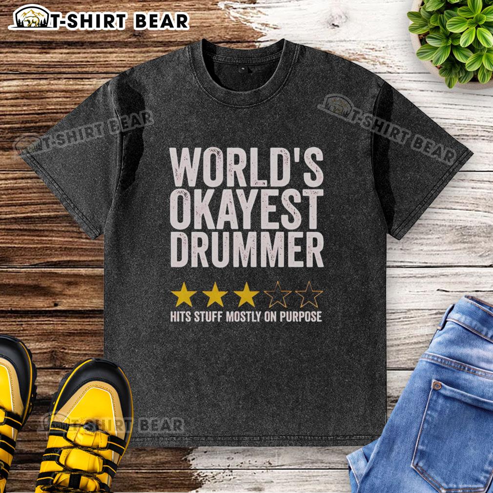 Original World'S Okayest Drummer Hits Stuff Mostly On Purpose Washed T Shirt Alt Text: Original Worlds Okayest Drummer Hits Stuff Mostly On Purpose washed t-shirt featuring a playful drum graphic.