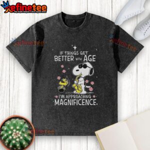 Alt Text: Original Snoopy and Woodstock graphic on a washed t-shirt, featuring the quote about approaching magnificence with age.
